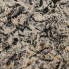 A Jackson Pollock abstract painting in shades of brown, black, and white